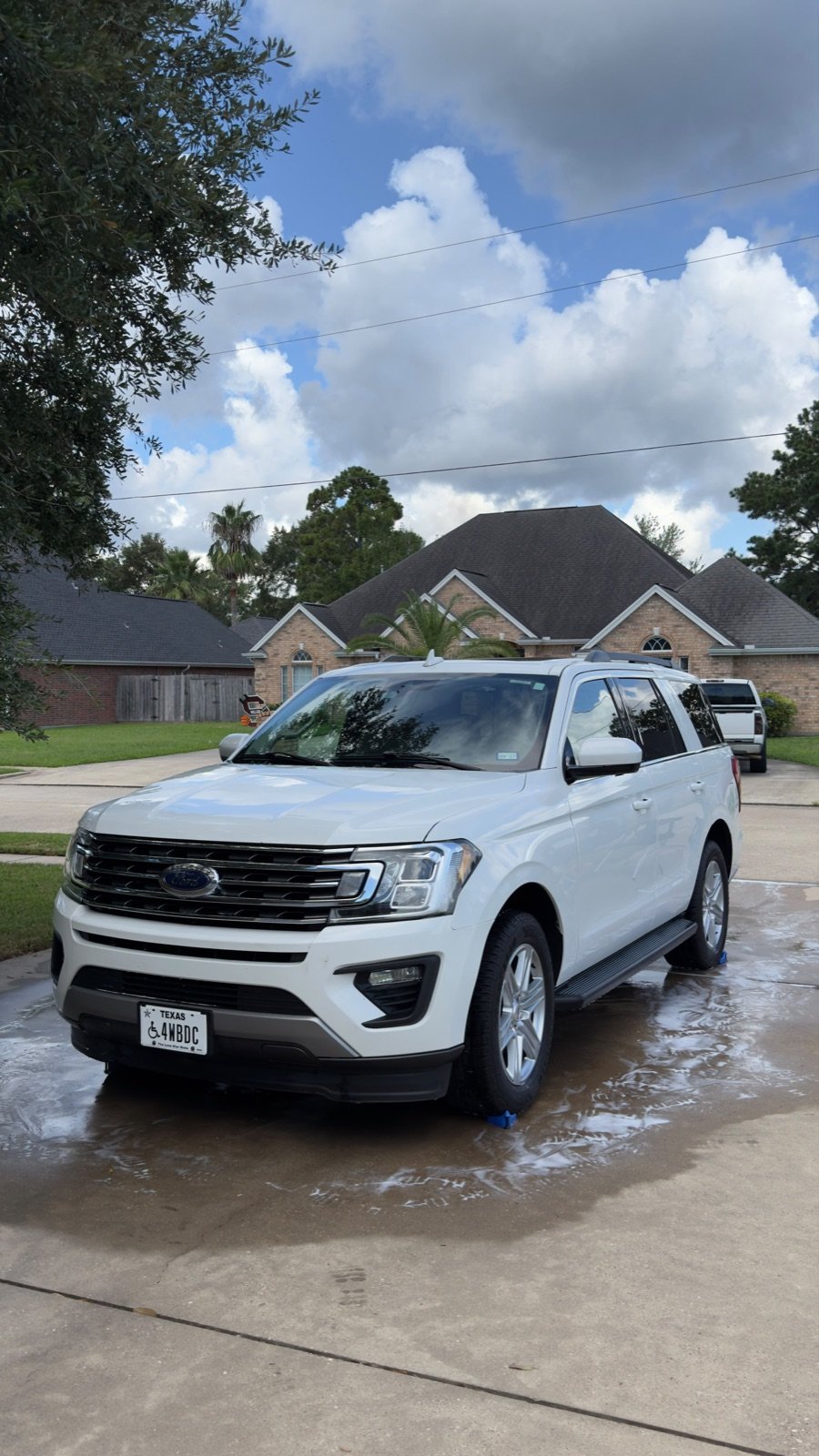 White Ford Expedition washed in a driveway