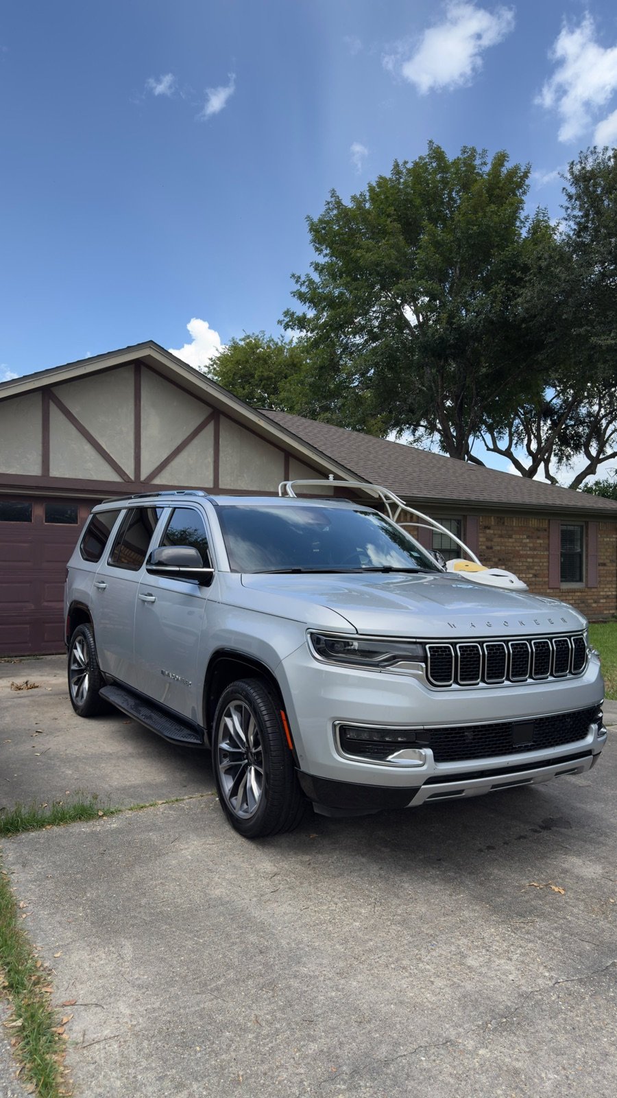 Silver Jeep Wagoneer detailed in a Southeast Texas driveway